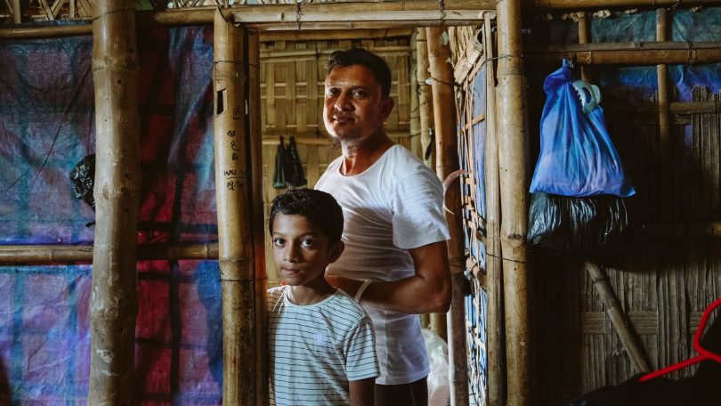 Noyum and son in their family shelter in the Rohingya refugee camps in Bangladesh (MSF-Victor Caringal)