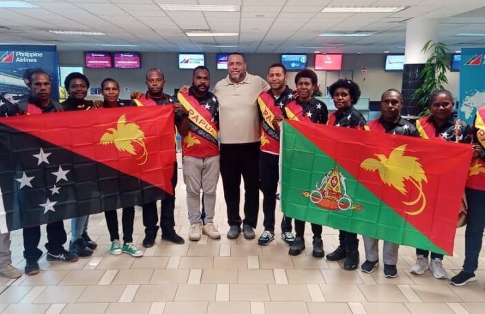 Governor Allan Bird (centre) with people from East Sepik leaving to work in Australia