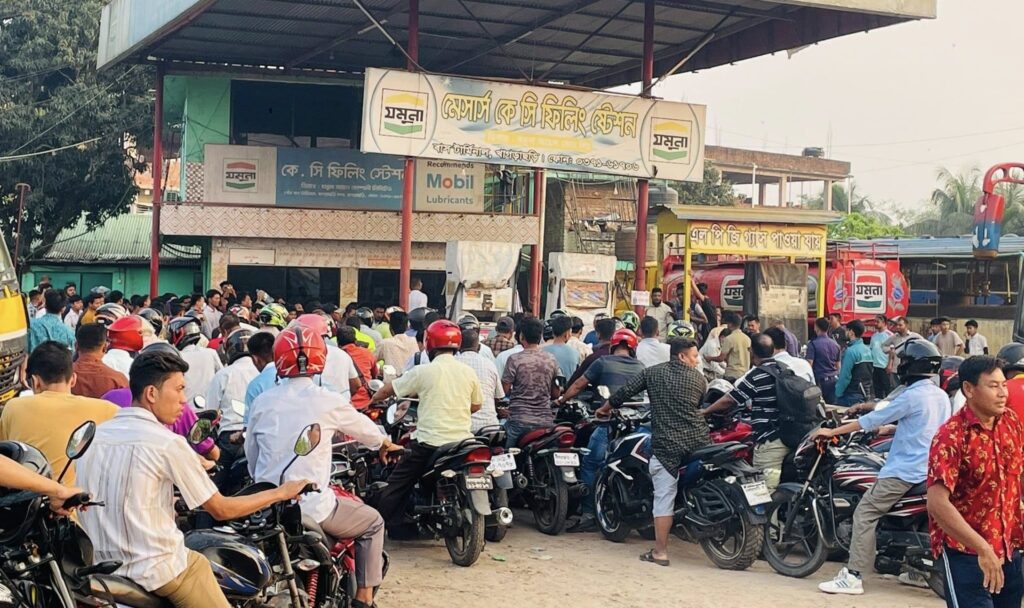Motorcyclists queue for fuel in Dhaka, Bangladesh