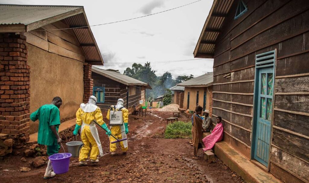 Health workers disinfect Case Du Salut health facility in Mabalako, North Kivu, Democratic Republic of Congo, one of the 37 health facilities being supported by the International Rescue Committee. A n