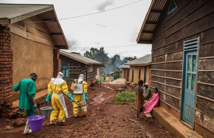 Health workers disinfect Case Du Salut health facility in Mabalako, North Kivu, Democratic Republic of Congo, one of the 37 health facilities being supported by the International Rescue Committee. A n